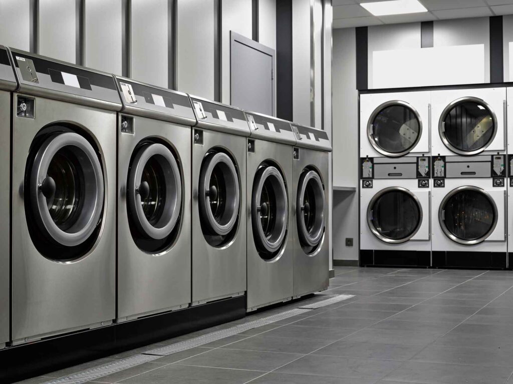 A row of industrial washing machines