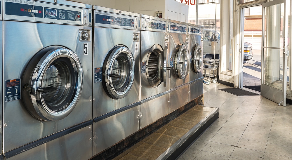 Washing machines in public laundromat, open front door