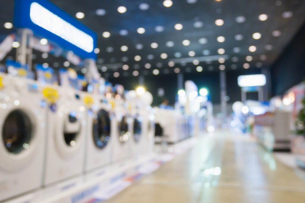 unfocused image of washing machines in large store