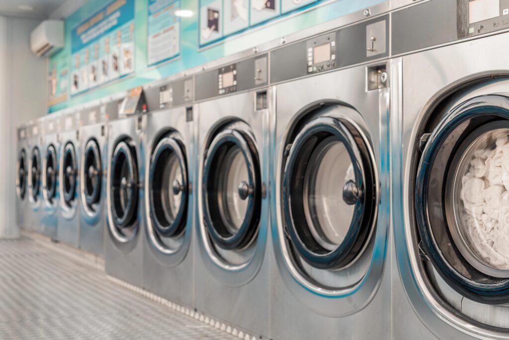 Row of washers in commercial laundromat