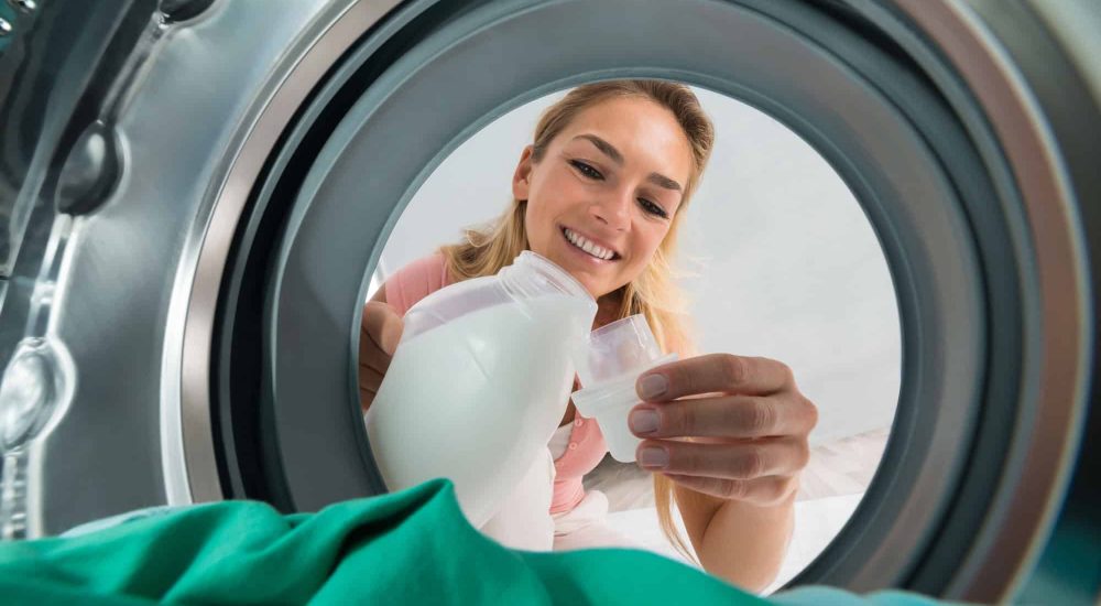 Smiling-a-woman-pouring-detergent